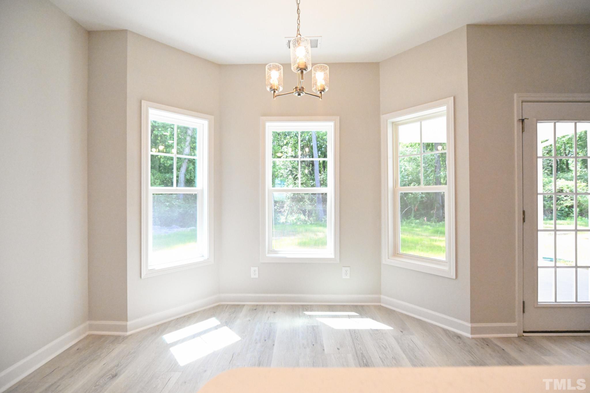 11 Kevin Troy Court Angier, NC 27501 - Photo 16 of 35 a view of an empty room with windows