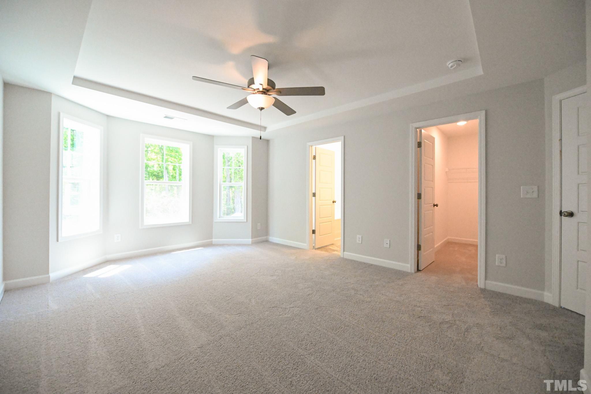 11 Kevin Troy Court Angier, NC 27501 - Photo 21 of 35 an empty room with windows and fan