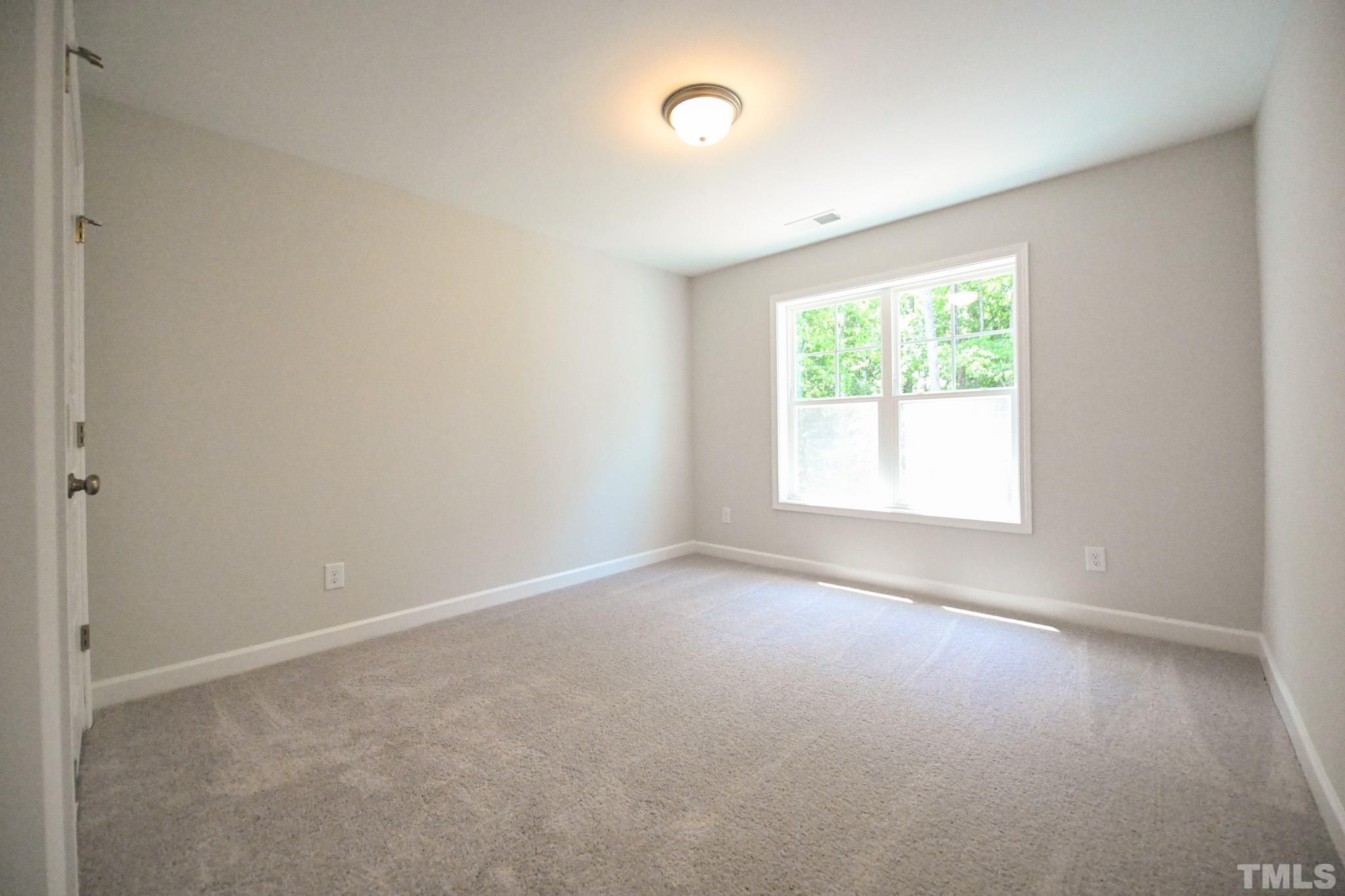 11 Kevin Troy Court Angier, NC 27501 - Photo 25 of 35 an empty room with windows