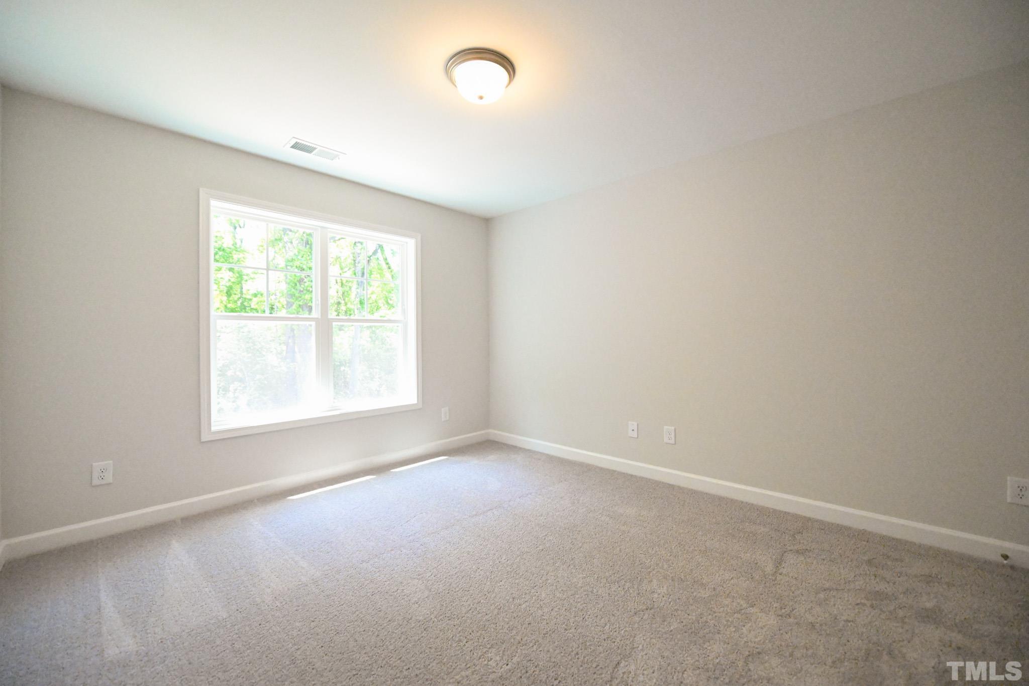 11 Kevin Troy Court Angier, NC 27501 - Photo 26 of 35 an empty room with windows