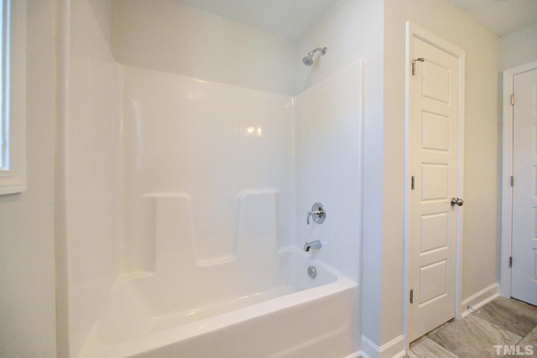 11 Kevin Troy Court Angier, NC 27501 - Photo 30 of 35 a bathroom with a bathtub