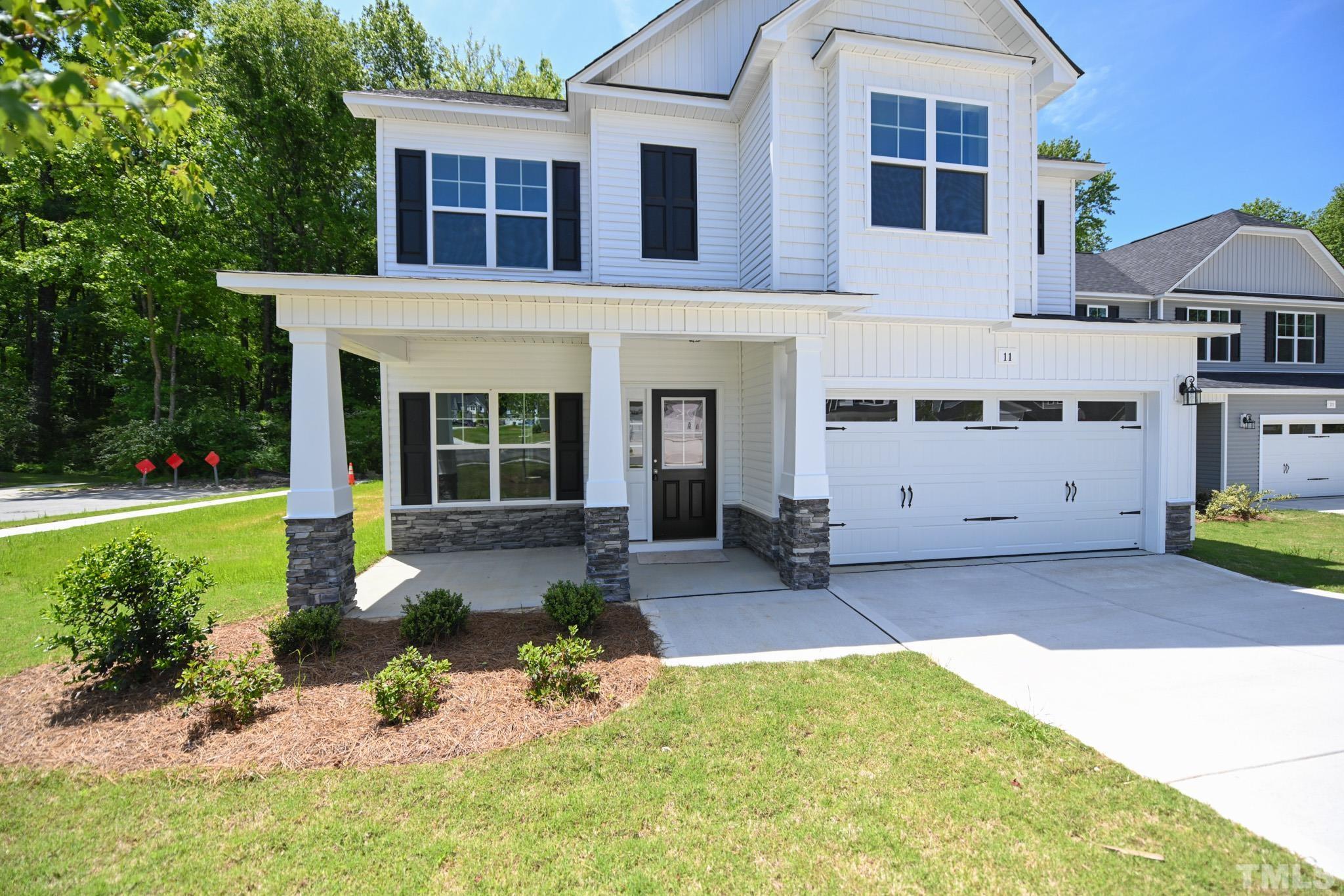 11 Kevin Troy Court Angier, NC 27501 - Photo 3 of 35 a front view of a house with a yard outdoor seating and yard