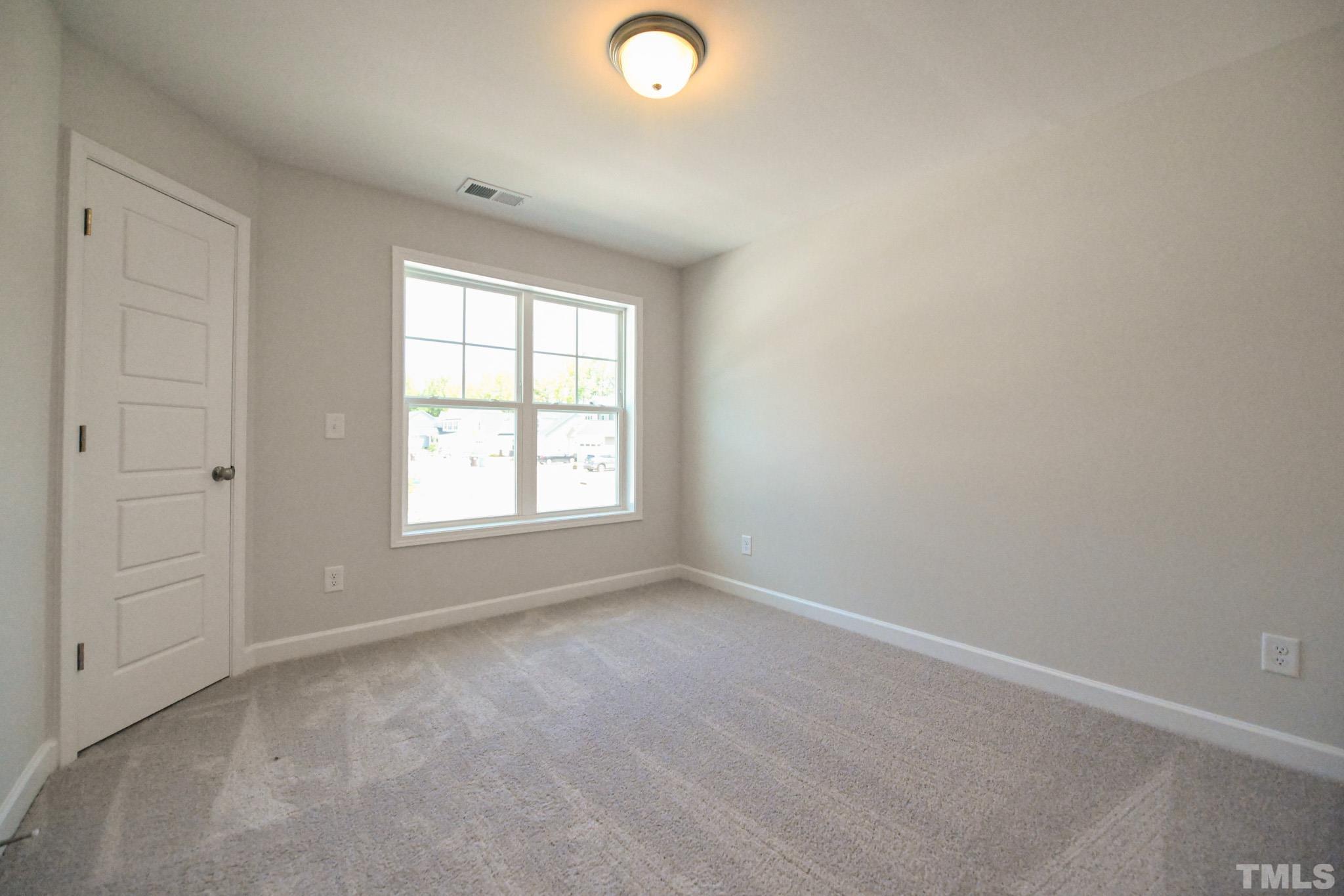 11 Kevin Troy Court Angier, NC 27501 - Photo 31 of 35 an empty room with windows and closet