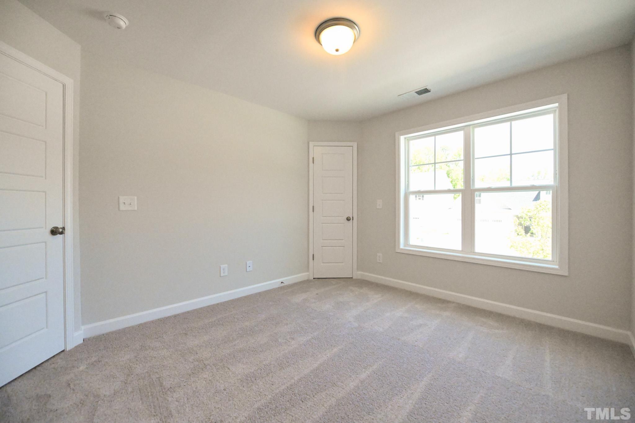 11 Kevin Troy Court Angier, NC 27501 - Photo 32 of 35 an empty room with a window