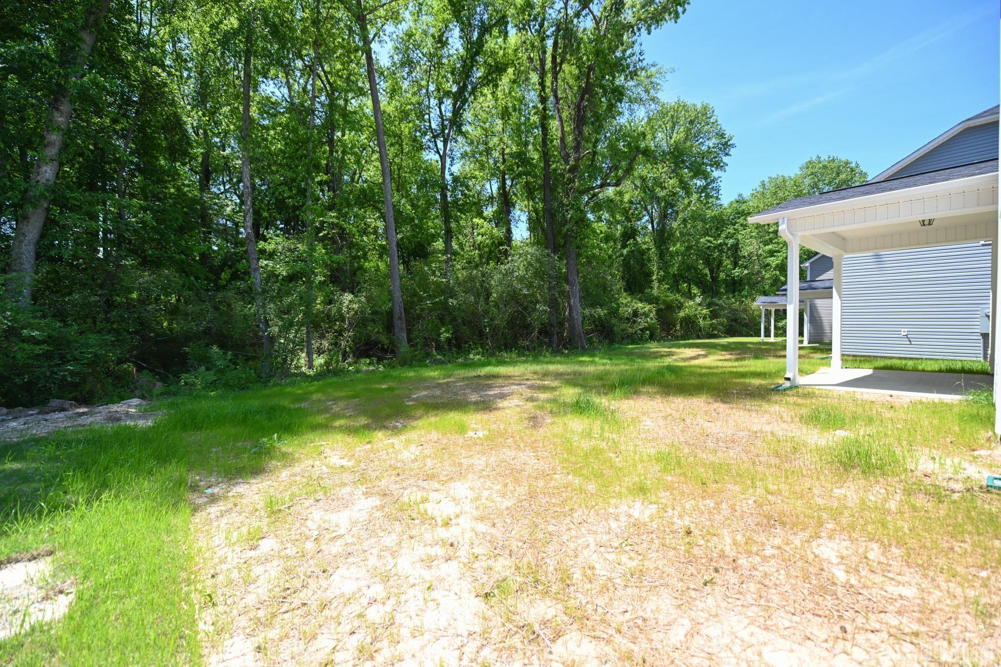 11 Kevin Troy Court Angier, NC 27501 - Photo 34 of 35 a view of a backyard with a small cabin