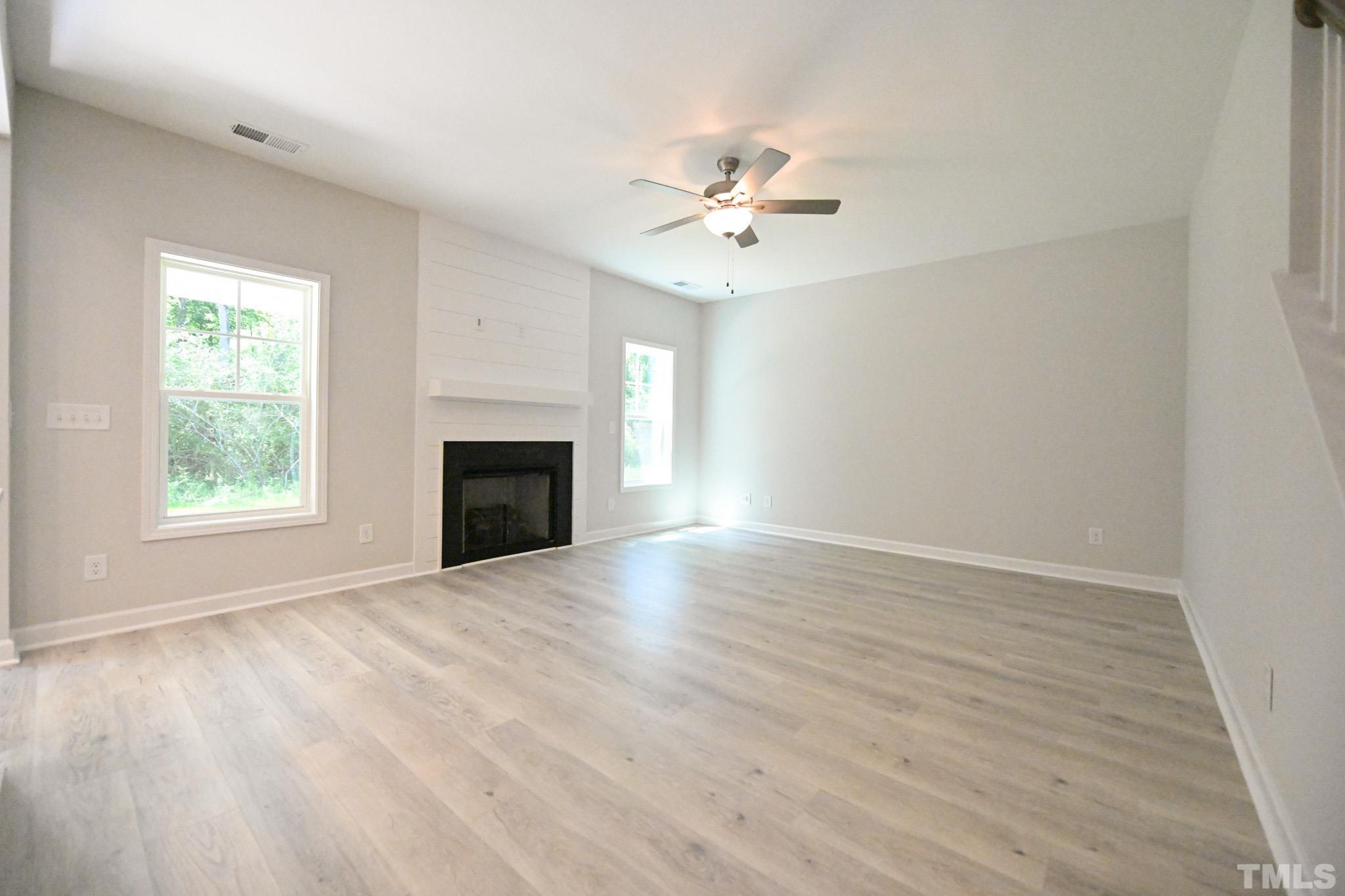 11 Kevin Troy Court Angier, NC 27501 - Photo 6 of 35 wooden floor in an empty room with a window
