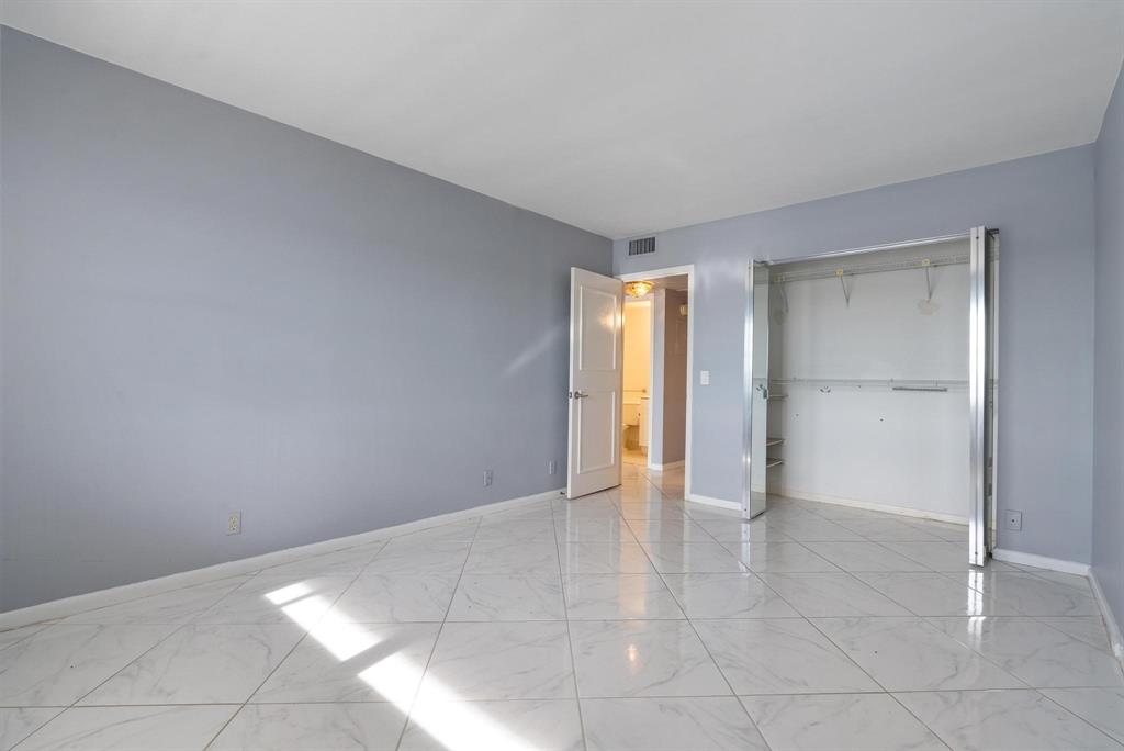 4036 Cornwall East, Unit 4036 Boca Raton, FL 33434 - Photo 11 of 30 a view of an empty room and fire place