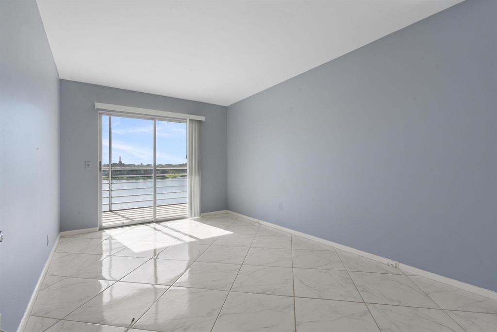 4036 Cornwall East, Unit 4036 Boca Raton, FL 33434 - Photo 13 of 30 an empty room with windows