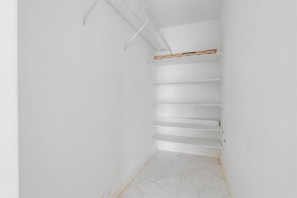 4036 Cornwall East, Unit 4036 Boca Raton, FL 33434 - Photo 15 of 30 a view of walk in closet with empty racks