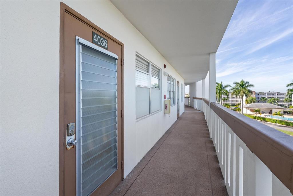 4036 Cornwall East, Unit 4036 Boca Raton, FL 33434 - Photo 20 of 30 a view of a hallway with wooden floor and plants