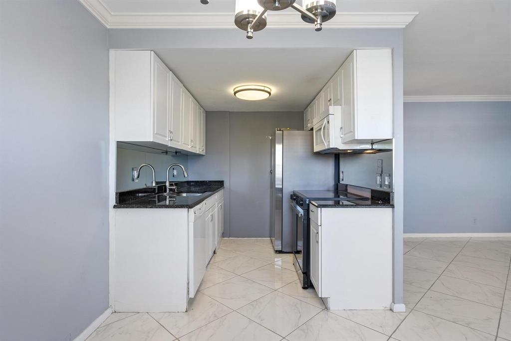 4036 Cornwall East, Unit 4036 Boca Raton, FL 33434 - Photo 2 of 30 a kitchen with stainless steel appliances granite countertop a sink stove and refrigerator