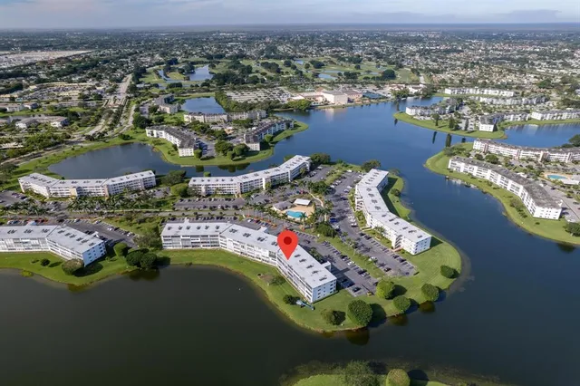 an aerial view of a house with a lake view