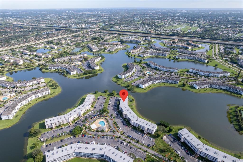 4036 Cornwall East, Unit 4036 Boca Raton, FL 33434 - Photo 26 of 30 an aerial view of a house with a lake