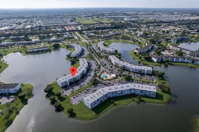 an aerial view of a house with a lake view