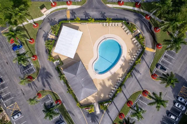 an aerial view of a house with a swimming pool