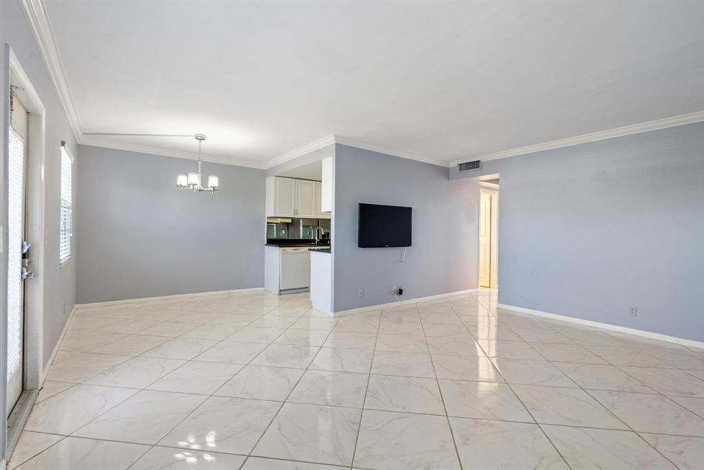4036 Cornwall East, Unit 4036 Boca Raton, FL 33434 - Photo 6 of 30 a view of a kitchen with a refrigerator and a stove