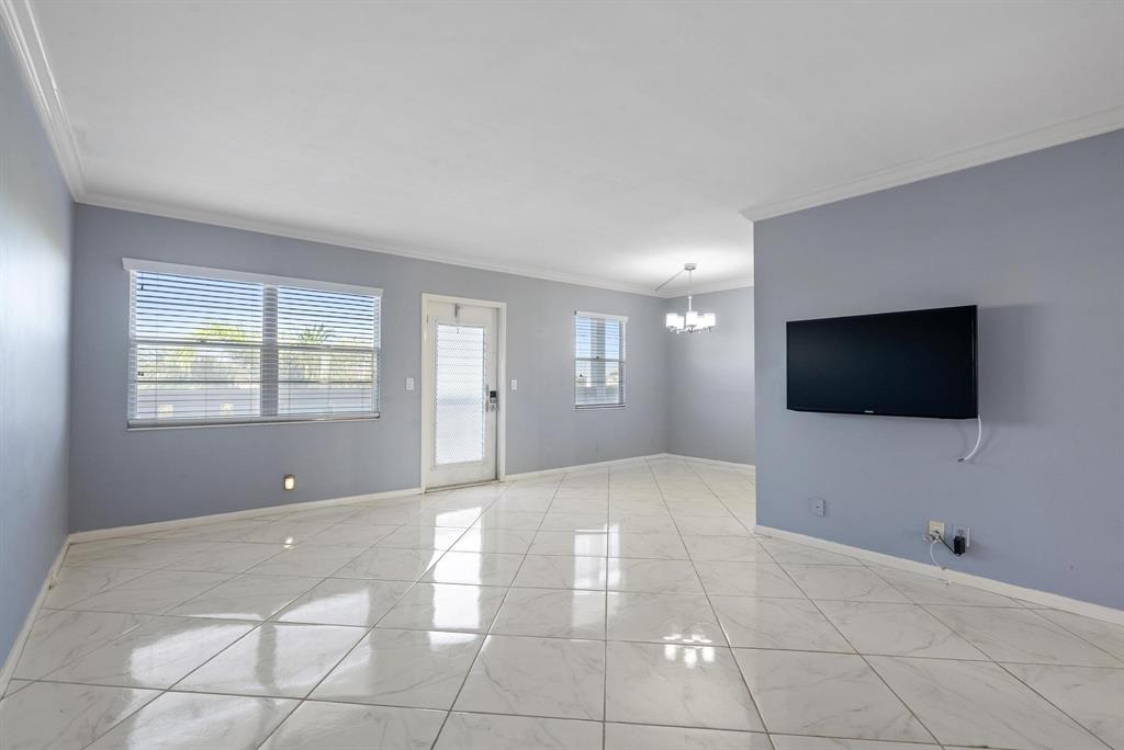 4036 Cornwall East, Unit 4036 Boca Raton, FL 33434 - Photo 8 of 30 a view of a livingroom with a flat screen tv