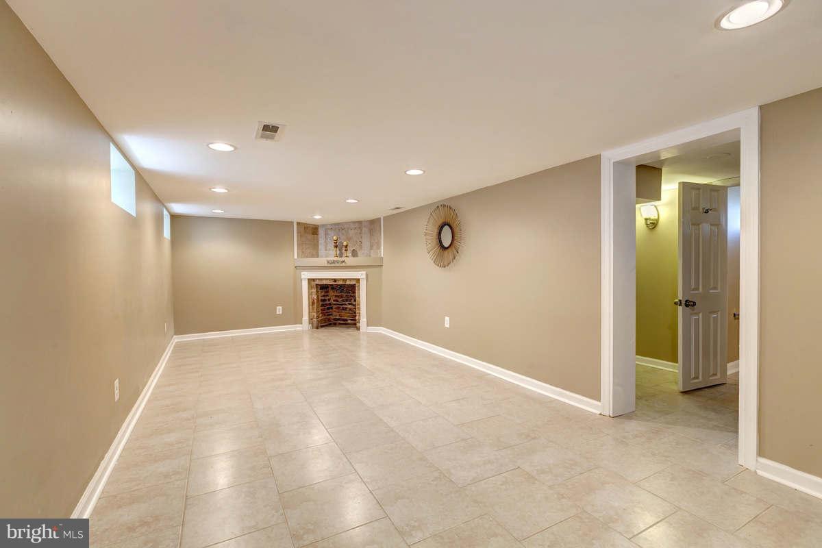 6303 Liberty Road Baltimore, MD 21207 - Photo 20 of 30 an empty room with kitchen and window