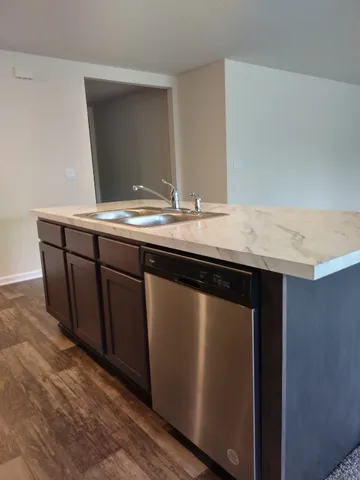 a kitchen with a sink and a window