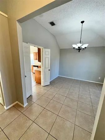 a view of a kitchen with a sink and a refrigerator window