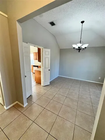 a view of a kitchen with a sink and a refrigerator window