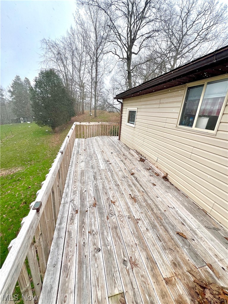 1012 Dugan Road Belpre, OH 45714 - Photo 7 of 29 Wooden deck featuring a lawn