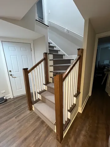 a view of a hallway with staircase