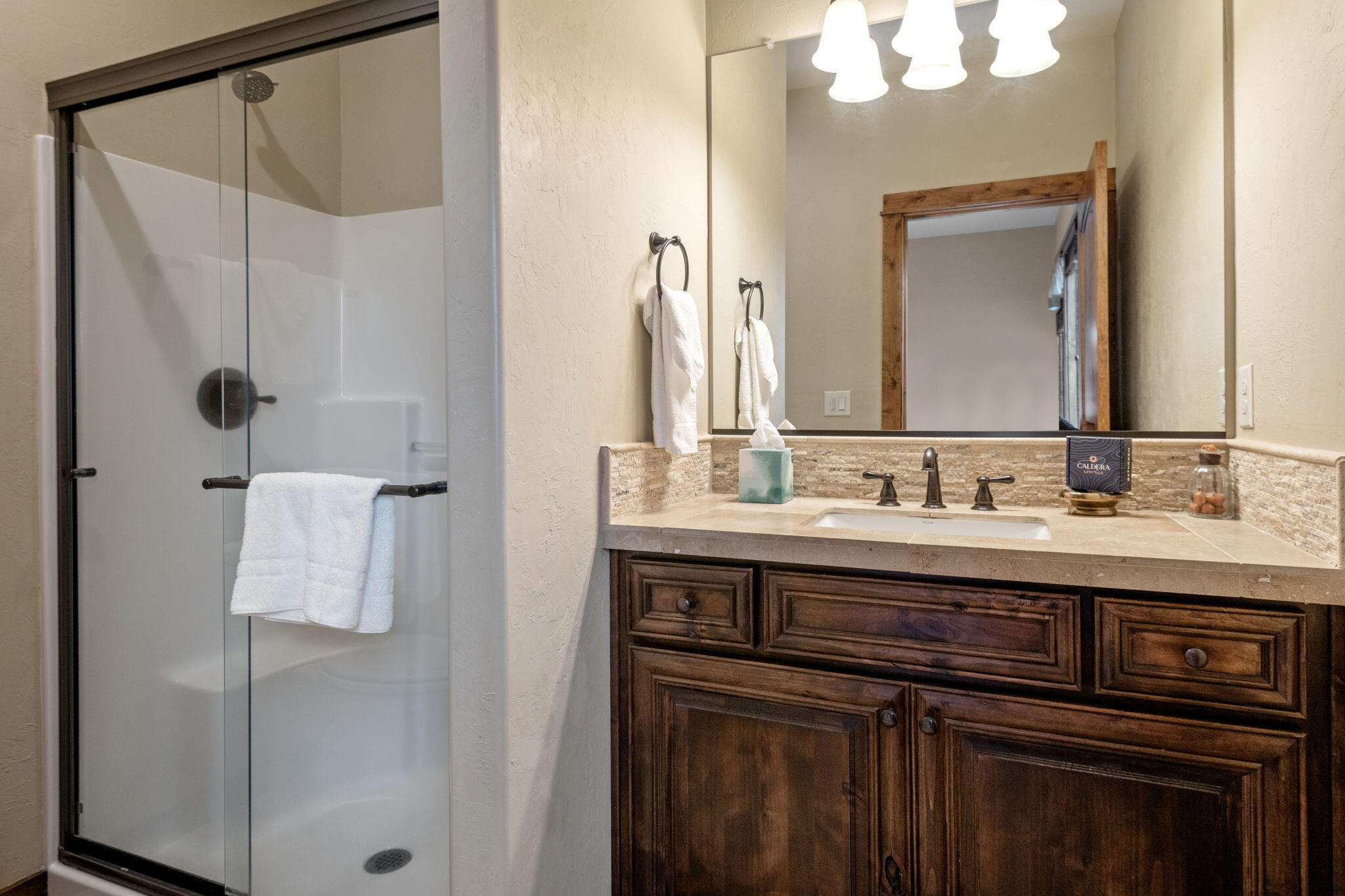 56508 Dancing Rock Loop, Unit 22 Bend, OR 97707 - Photo 38 of 69 a bathroom with a sink vanity and a mirror