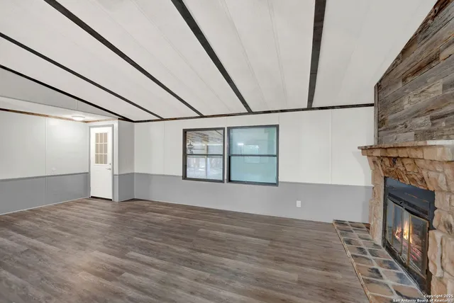 a kitchen with a sink and large window