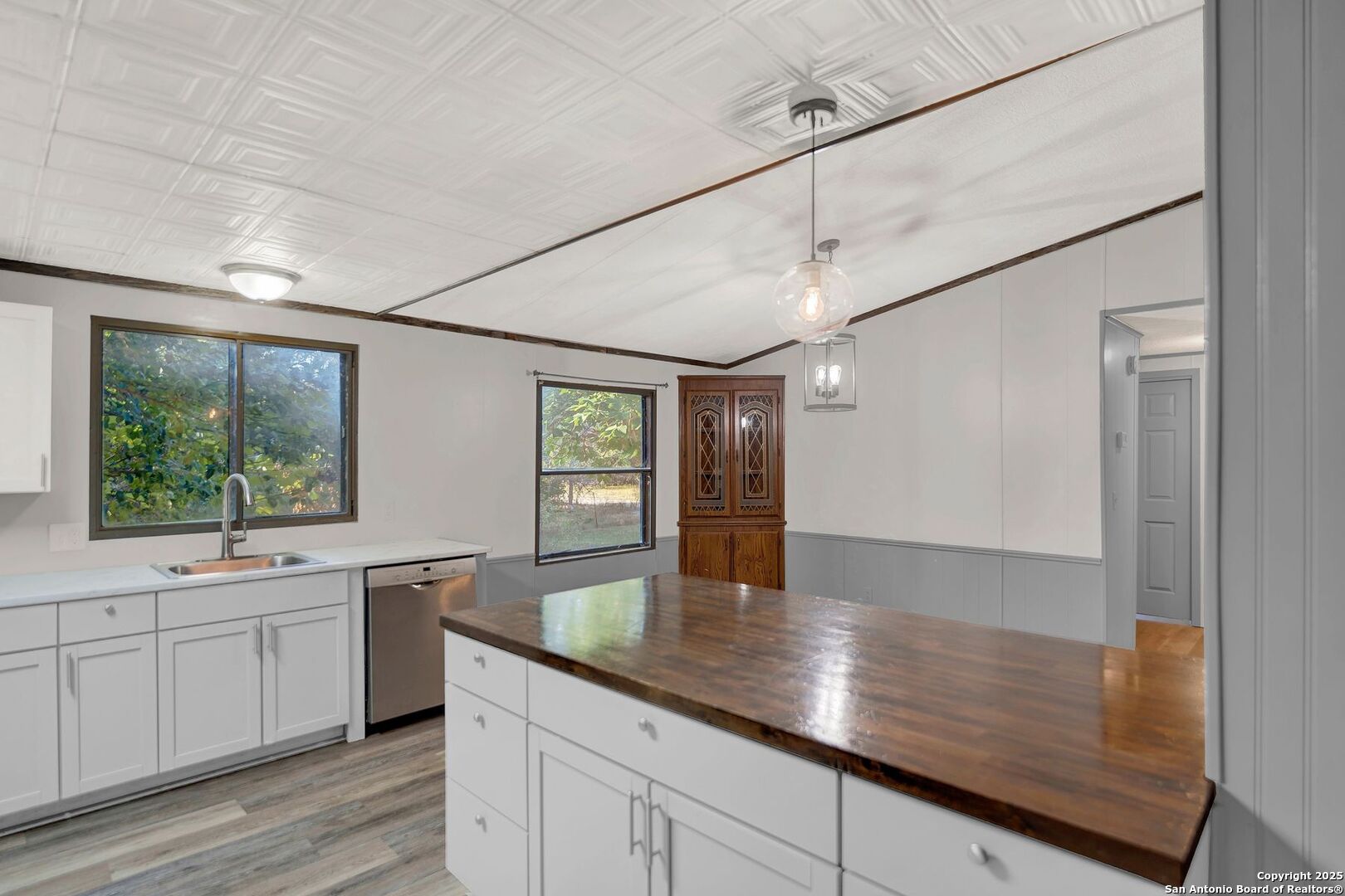 245 Bandera Drive Bandera, TX 78003 - Photo 14 of 37 a kitchen with a sink and large window