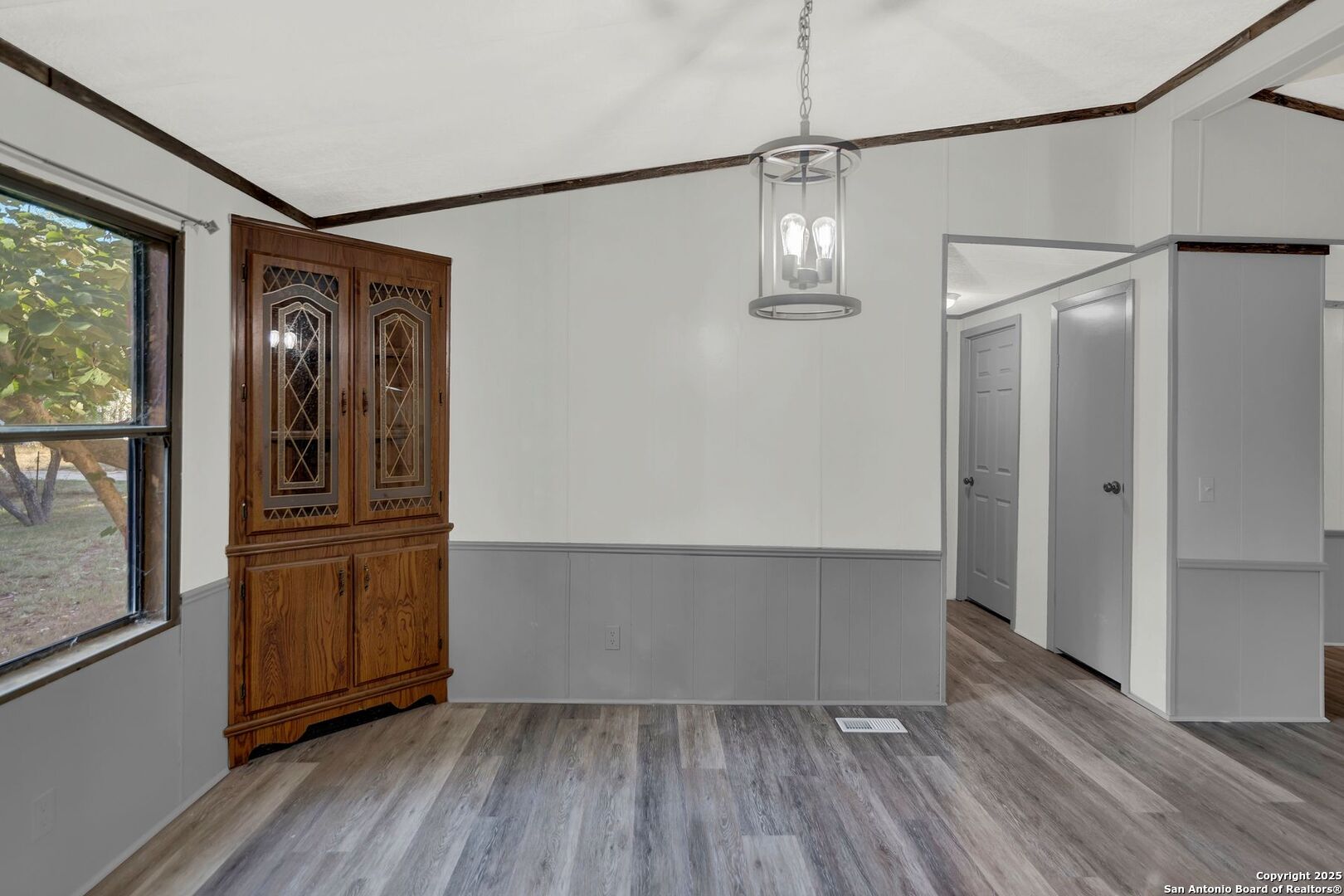 245 Bandera Drive Bandera, TX 78003 - Photo 20 of 37 a view of a hallway with wooden floor and door