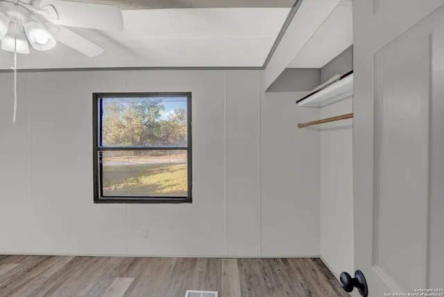 a bathroom with a shower and a sink