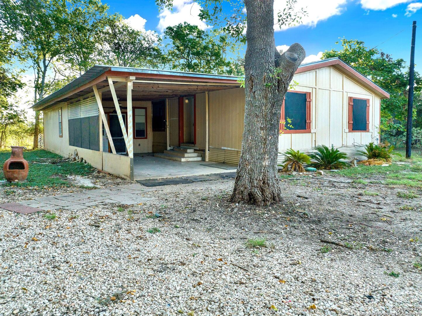 245 Bandera Drive Bandera, TX 78003 - Photo 6 of 37 a view of a house with backyard and garden