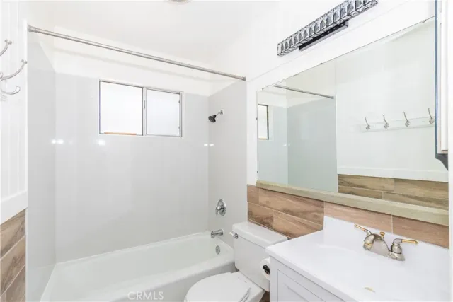 a kitchen that has a sink and a stove