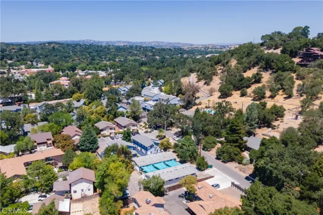 an aerial view of a house with a lot of trees