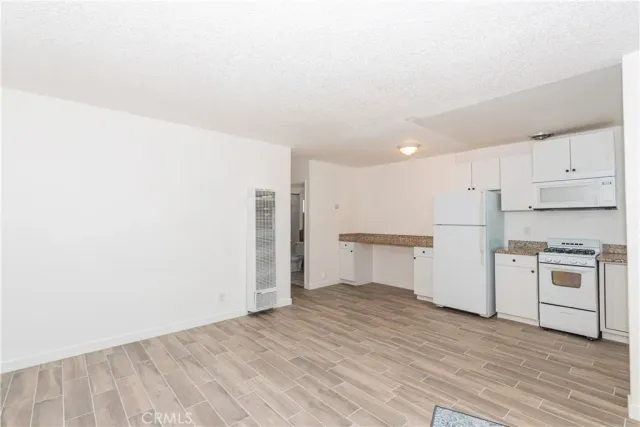 a view of kitchen with wooden floor