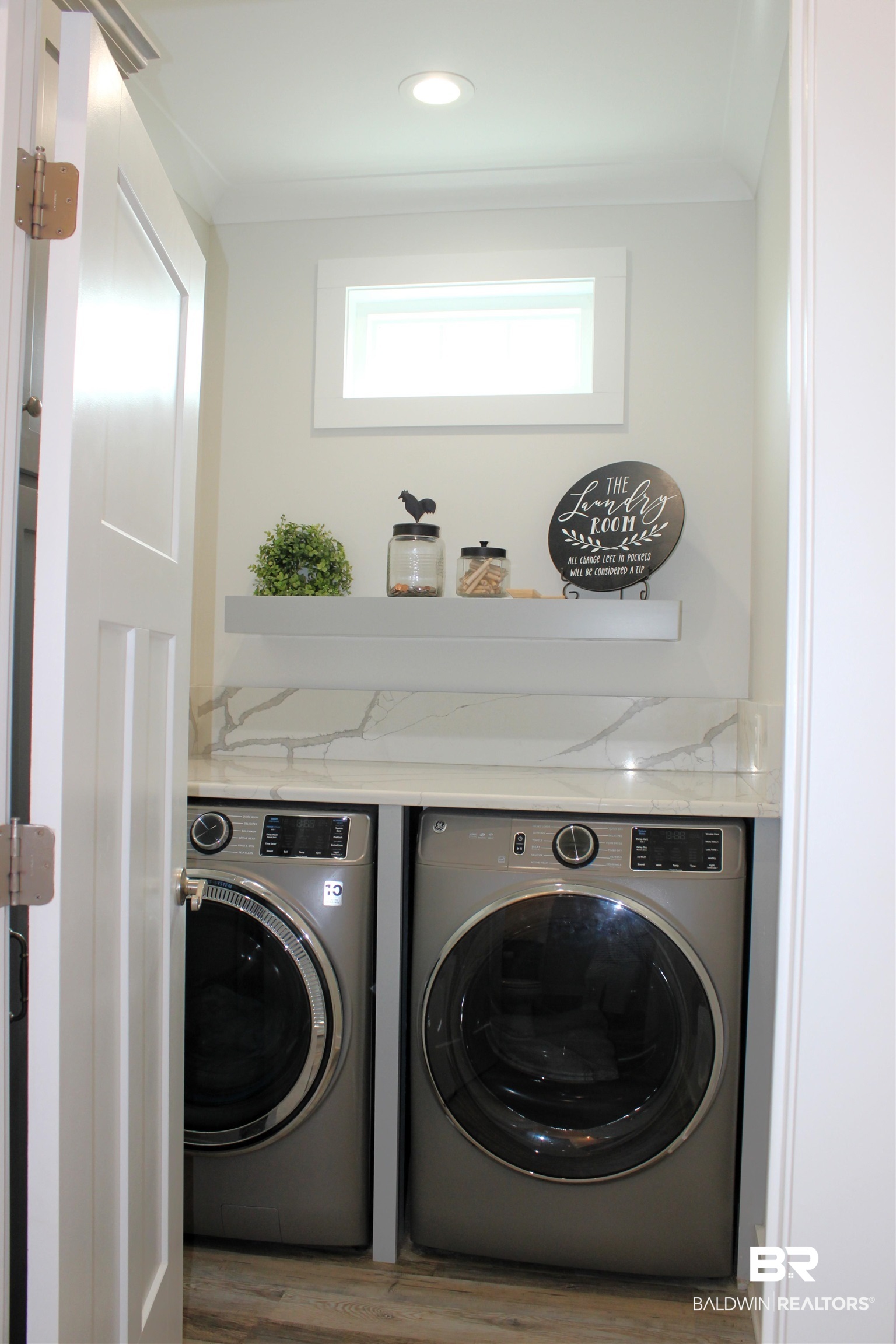 28058 Migratory Way, Unit 100 Elberta, AL 36530 - Photo 45 of 83 Clothes washing area with washing machine and dryer, wood finished floors, and laundry area