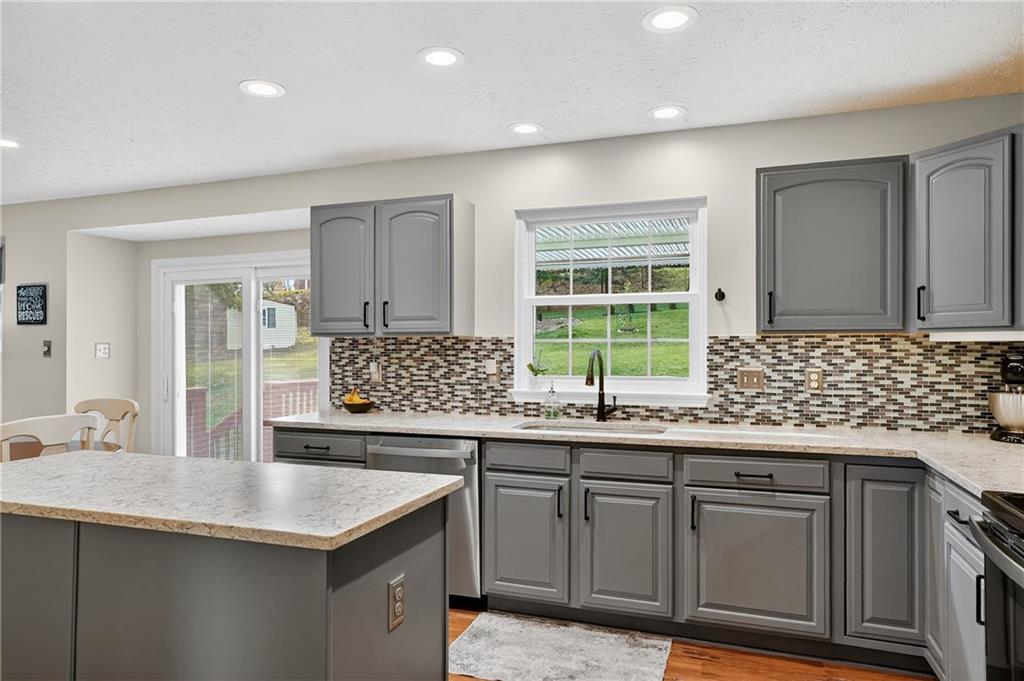 224 Field Club Circle McKees Rocks, PA 15136 - Photo 14 of 41 a kitchen with granite countertop a sink and a window