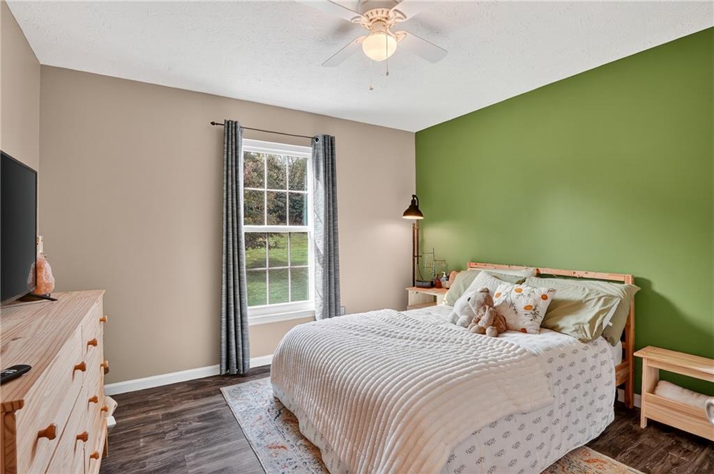 224 Field Club Circle McKees Rocks, PA 15136 - Photo 22 of 41 a bedroom with a bed and a flat tv screen on dresser