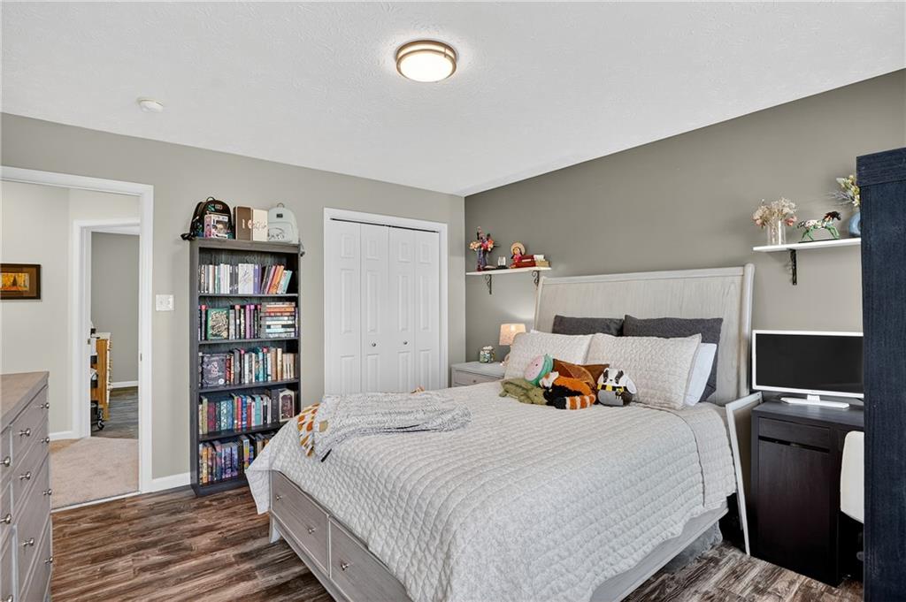 224 Field Club Circle McKees Rocks, PA 15136 - Photo 24 of 41 a bedroom with a bed and book shelf
