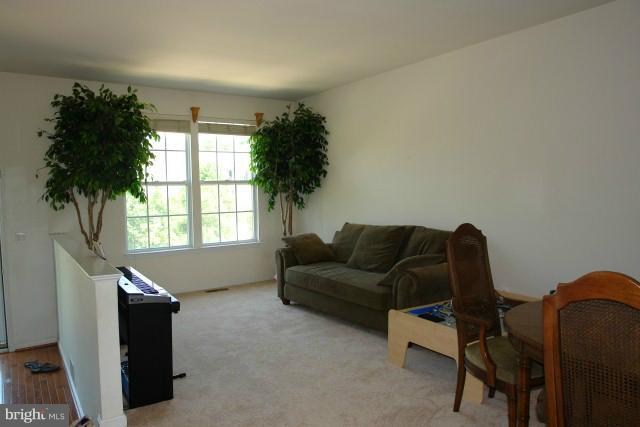 43191 Riders Square Broadlands, VA 20148 - Photo 1 of 21 a living room with furniture and a window