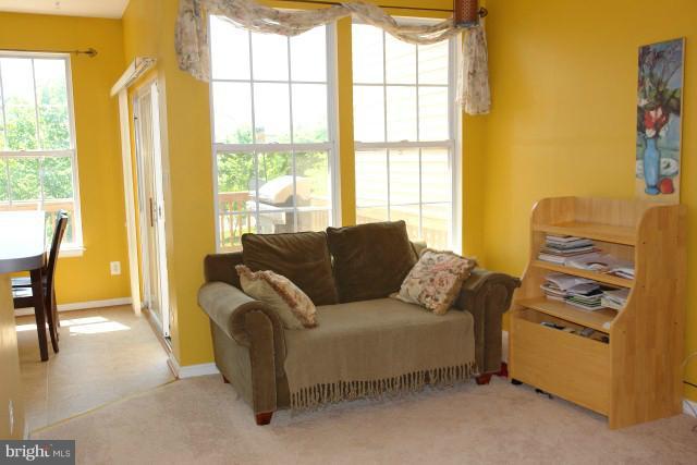 43191 Riders Square Broadlands, VA 20148 - Photo 2 of 21 a living room with furniture and a window