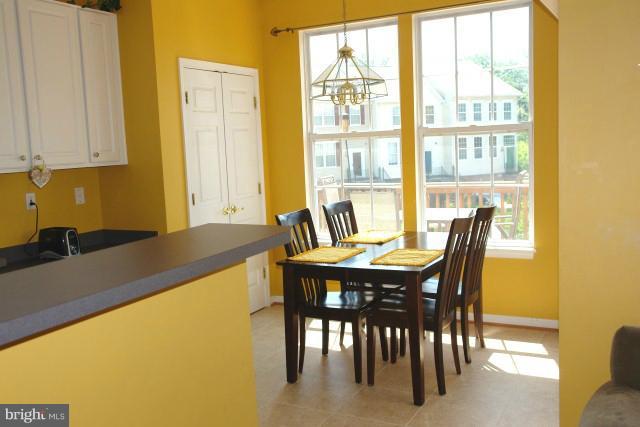 43191 Riders Square Broadlands, VA 20148 - Photo 14 of 21 a view of a dining room with furniture and a window