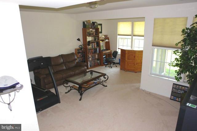 43191 Riders Square Broadlands, VA 20148 - Photo 3 of 21 a living room with furniture rug and a window