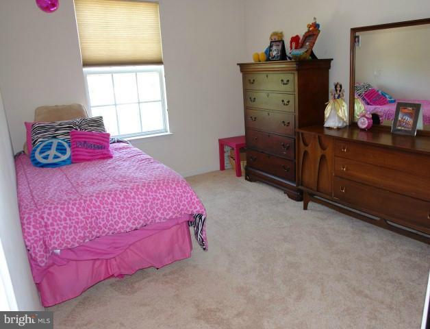 43191 Riders Square Broadlands, VA 20148 - Photo 5 of 21 a bedroom with a bed dresser and a window