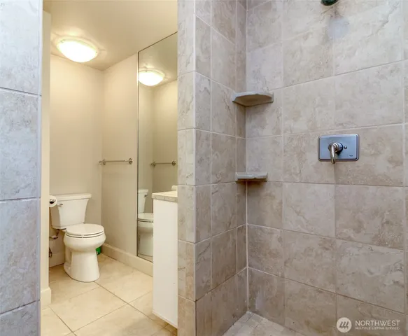 a view of a kitchen with a table and chairs in it
