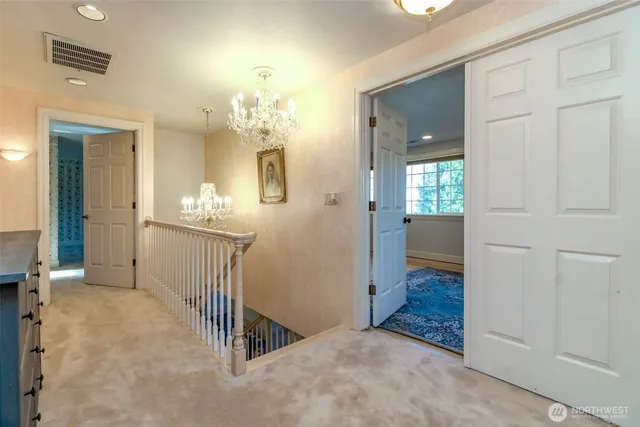 a view of a hallway to a bedroom