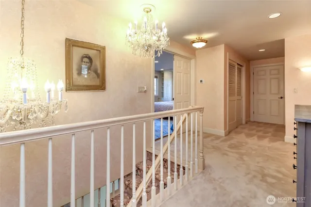 an empty room with windows and fireplace