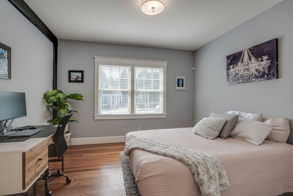 11 Fletcher Road, Unit 11 Bedford, MA 01730 - Photo 11 of 31 a bedroom with a bed and a potted plant