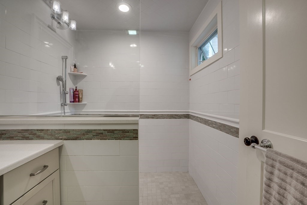 11 Fletcher Road, Unit 11 Bedford, MA 01730 - Photo 20 of 31 a bathroom with a sink and a mirror